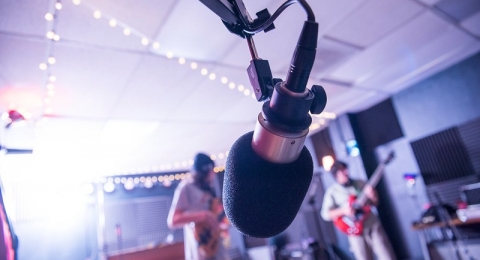 KRFH studio with microphone in focus