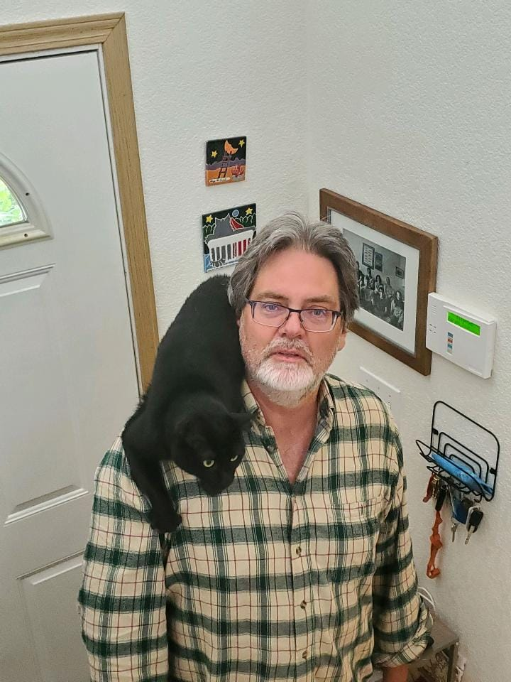 Picture of Dean Jeff Crane and his cat Shadow